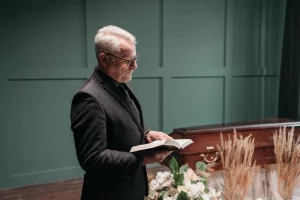 A pastor standing with Bible