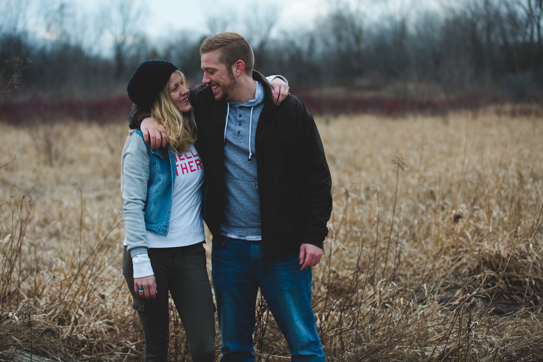 photo of couple near the field