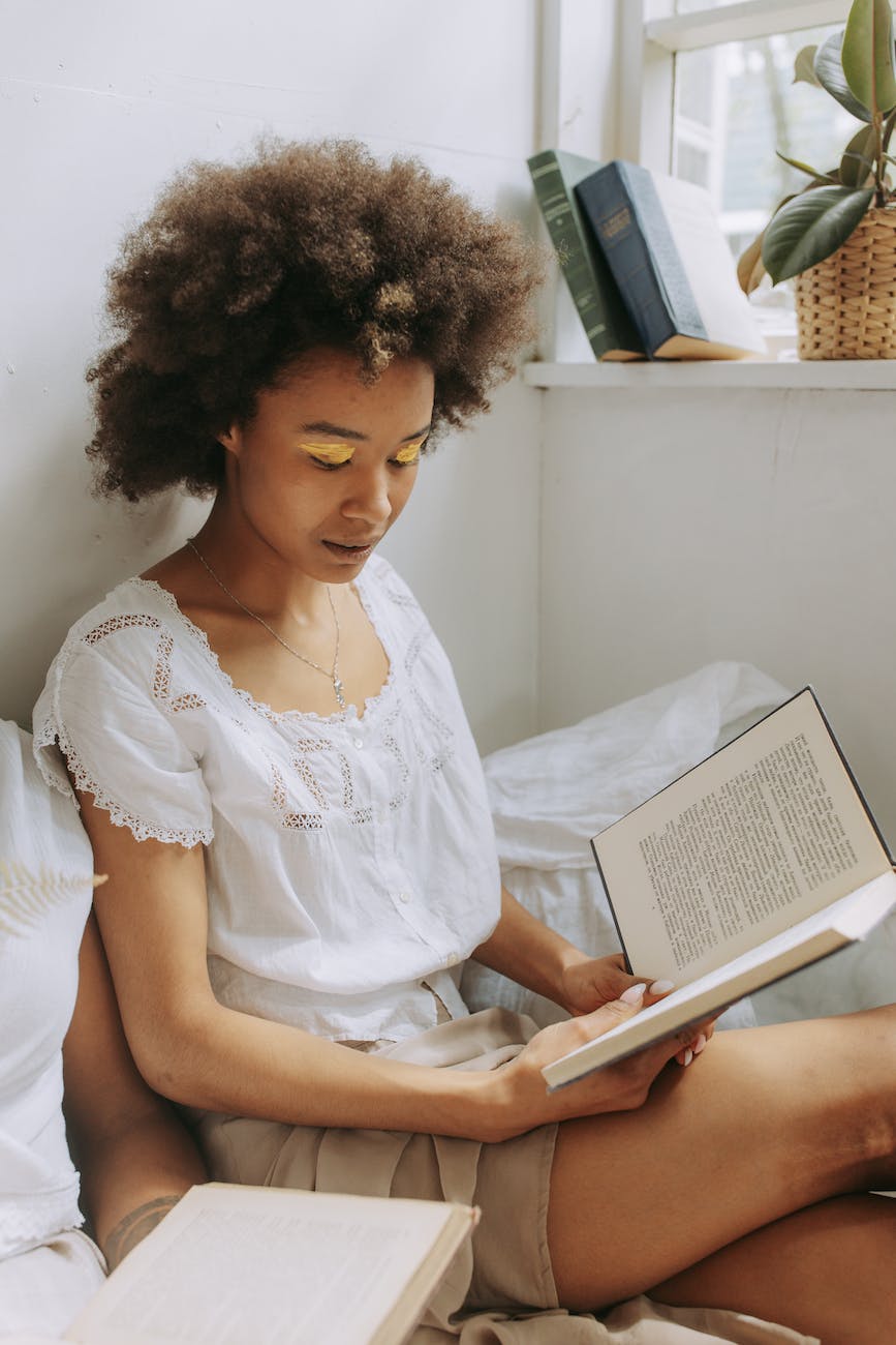 woman sitting and reading a book