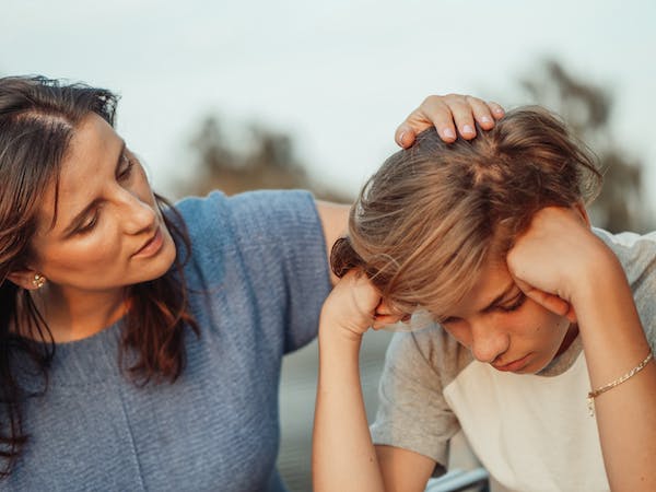 mother consoling son